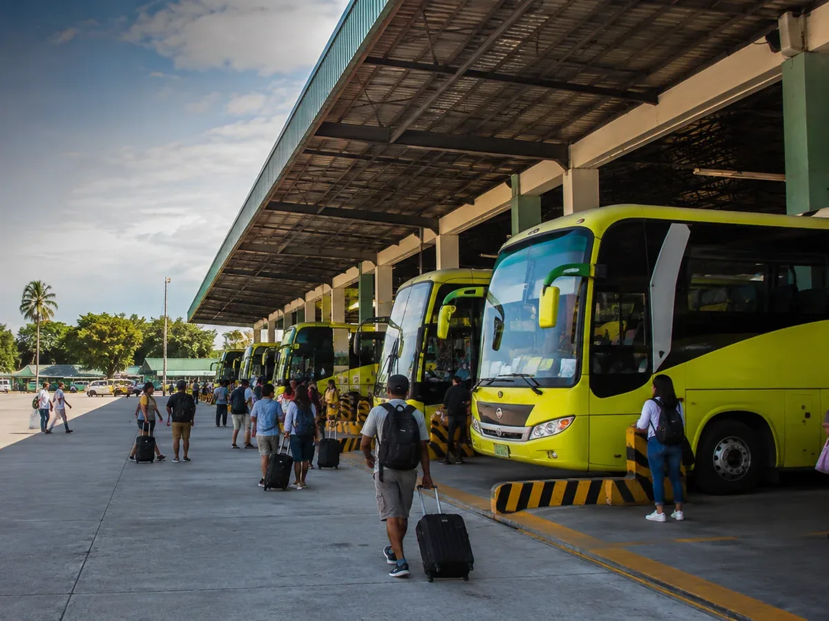 Passengers at a provincial bus terminal in the Philippines